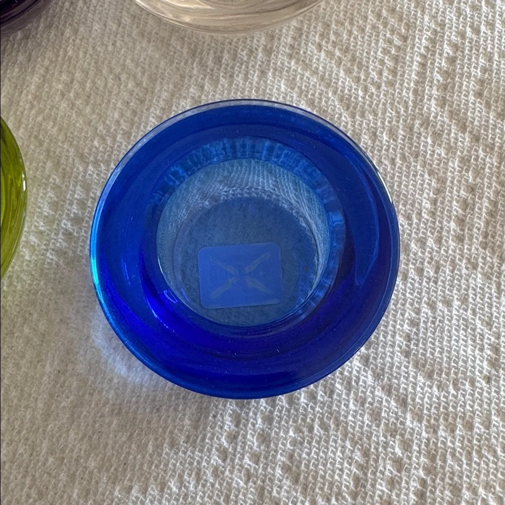 Crate & Barrel set of 4 multicolored tealights cobalt, clear, purple, lime.